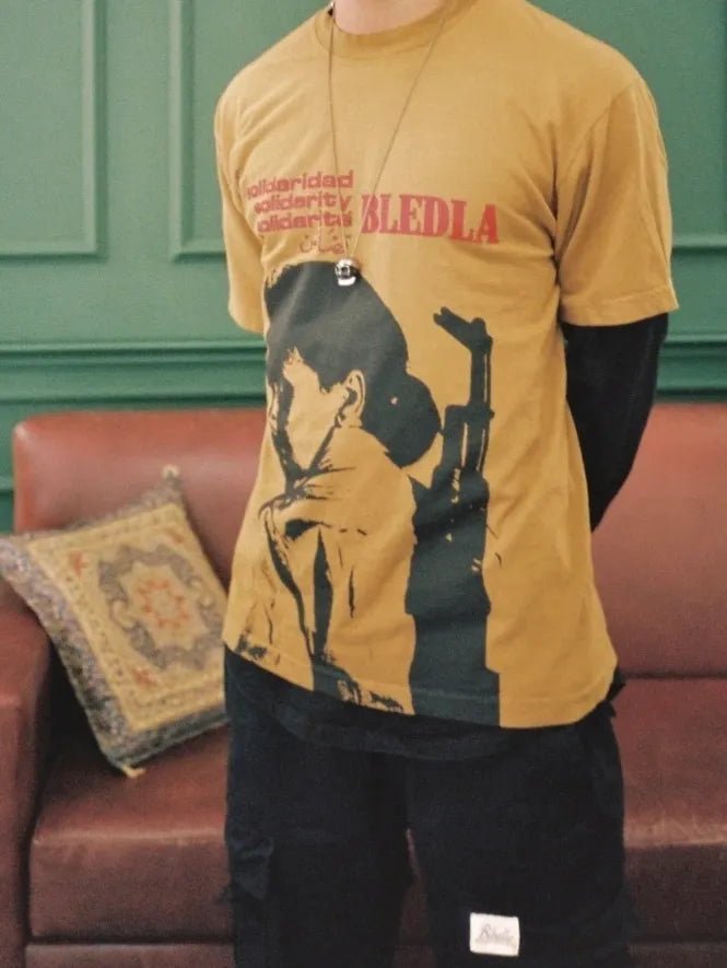 BLÉDLA Solidarity Garment Dye Tee - Brass - Pluto 5ive LLC T-Shirt